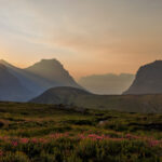 Sunrise illuminating mountain peaks at Logan Pass in Glacier National Park