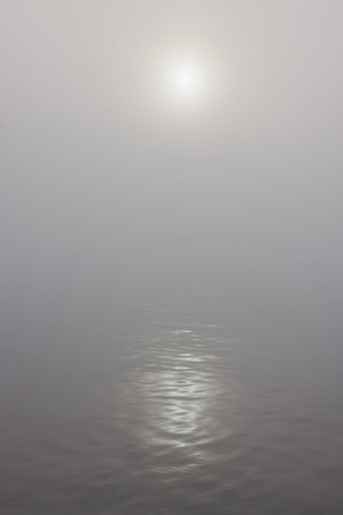 The Sun and Reflection in the Fog