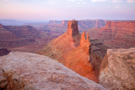 Desert Towers at Marlboro Point in Canyonlands lit by the sunrise.
